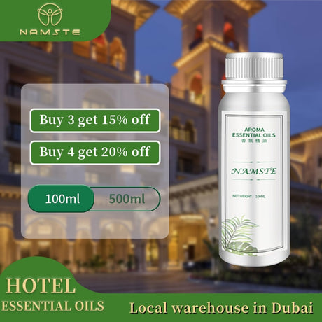 Namste essential oil bottle with promotional text overlay on a blurred hotel background
