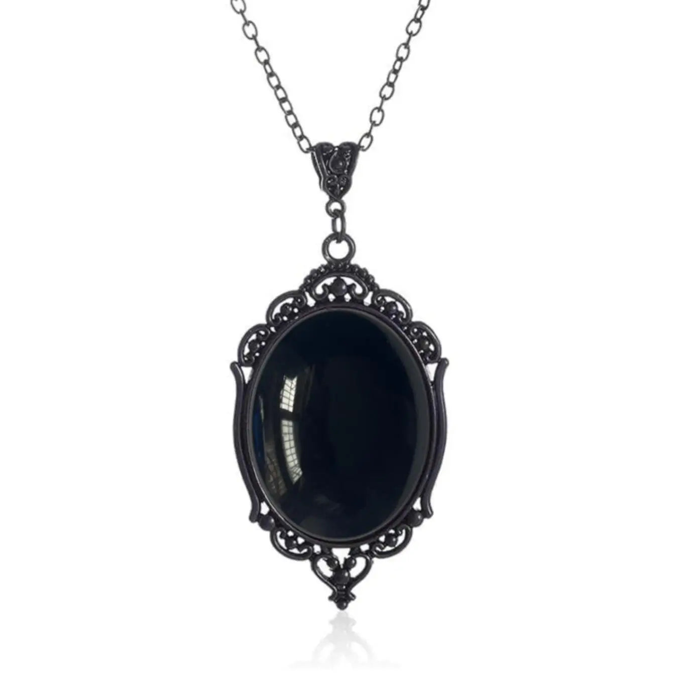 Black ornate pendant necklace on a white background