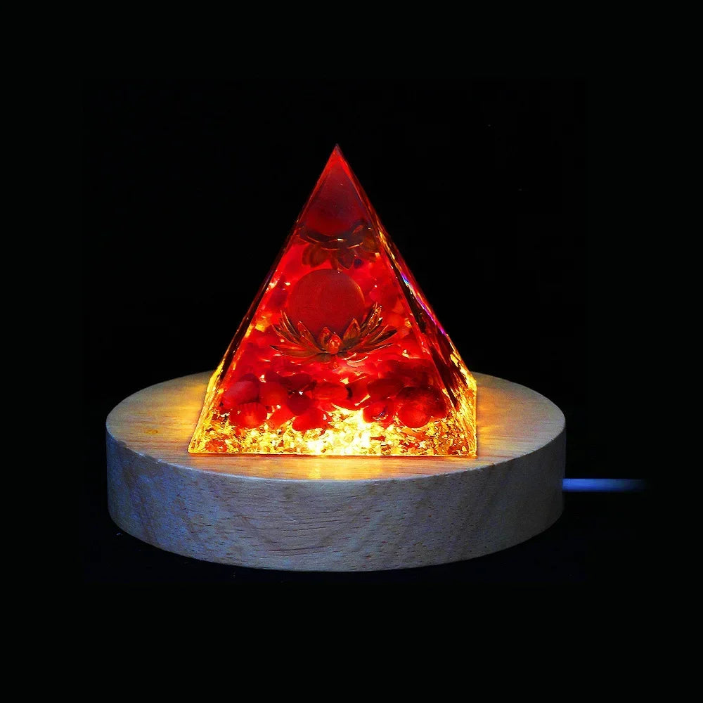 Pyramid-shaped light on a wooden base with a dark background