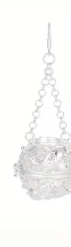 Decorative hanging basket with intricate design on a white background