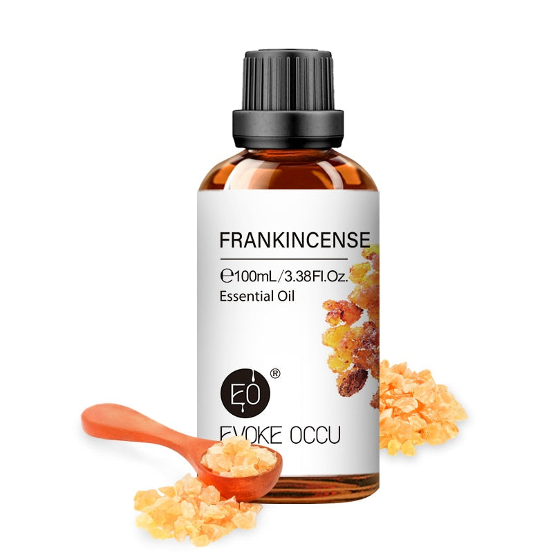 Frankincense essential oil bottle with frankincense resin on a white background, featuring Evoke Occu branding.