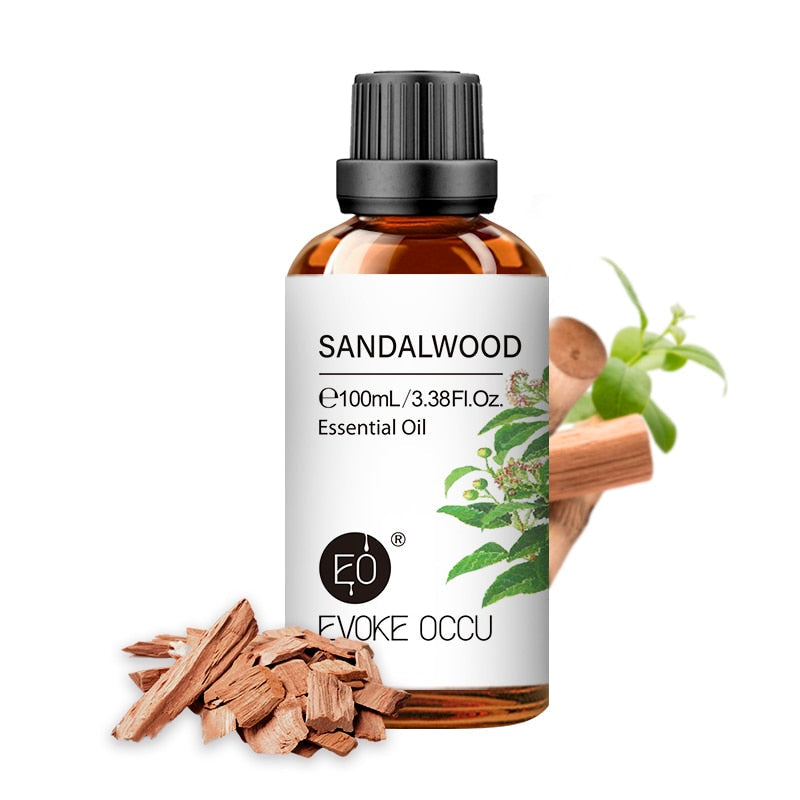 Sandalwood essential oil bottle with sandalwood pieces and leaves on a white background, featuring Evoke Occu branding.