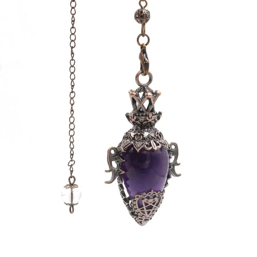 Purple heart-shaped pendant with intricate metalwork on a white background
