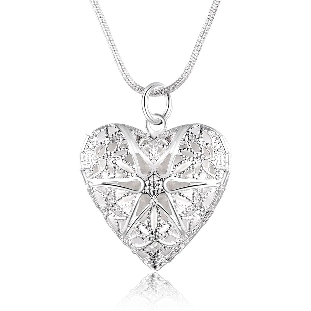 Silver heart-shaped pendant necklace on a white background