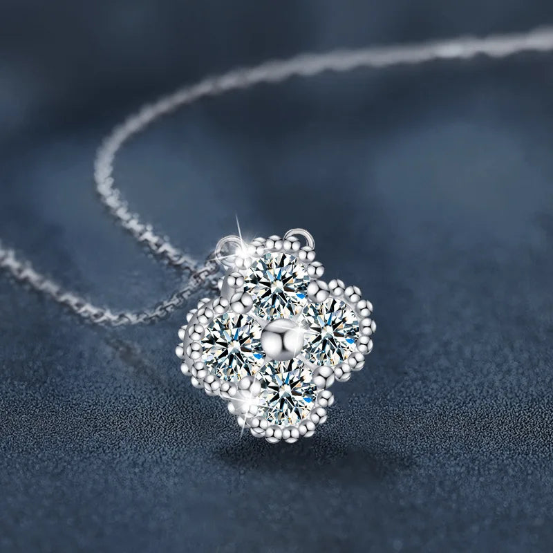 Silver necklace with a floral pendant on a dark blue background
