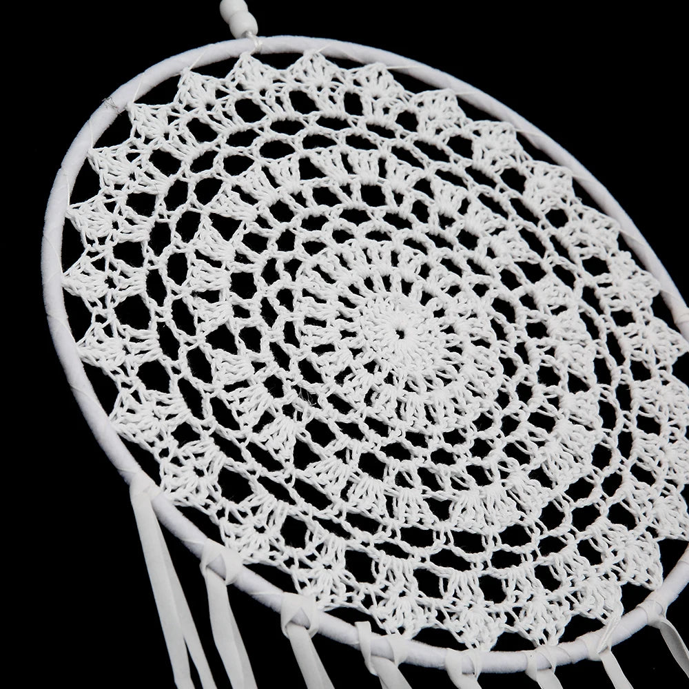 White crocheted doily on a black background