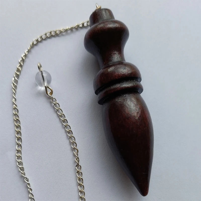 Wooden pendant with chain on a white background