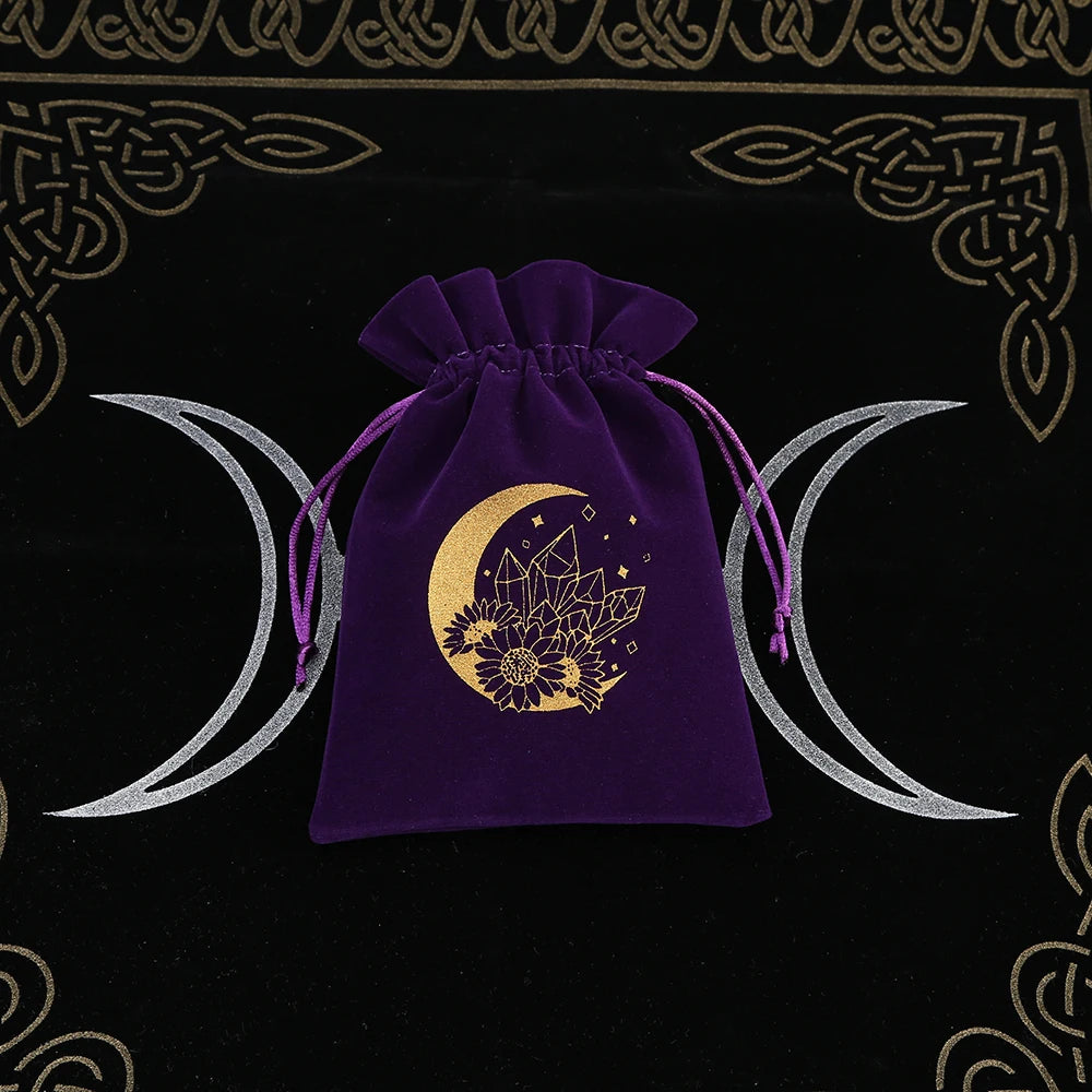 Purple drawstring bag with gold moon and crystal design on a black background with Celtic patterns