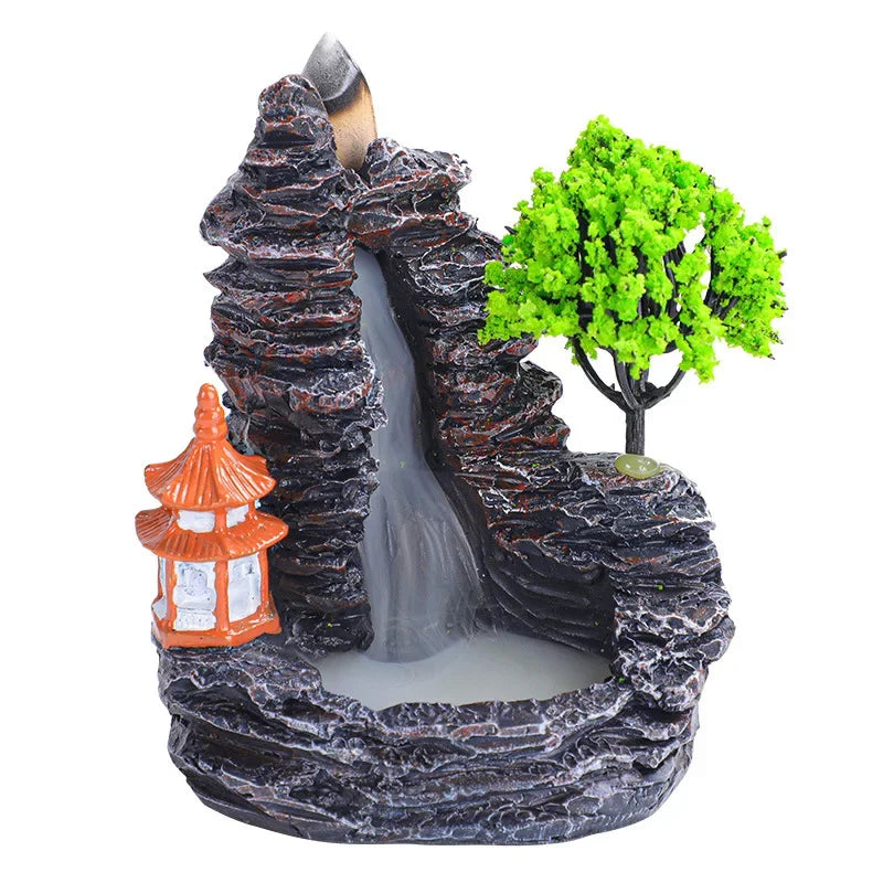 Decorative fountain with rocks, waterfall, tree, and pagoda on a white background