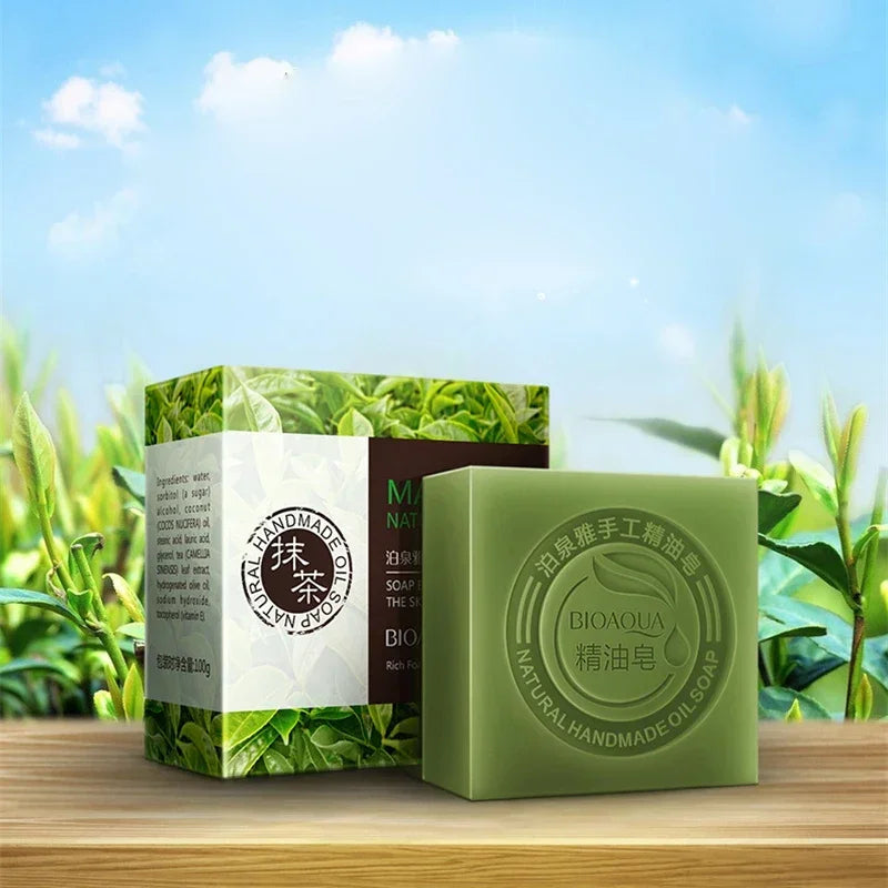 Green soap bar and packaging on a wooden surface with a natural background