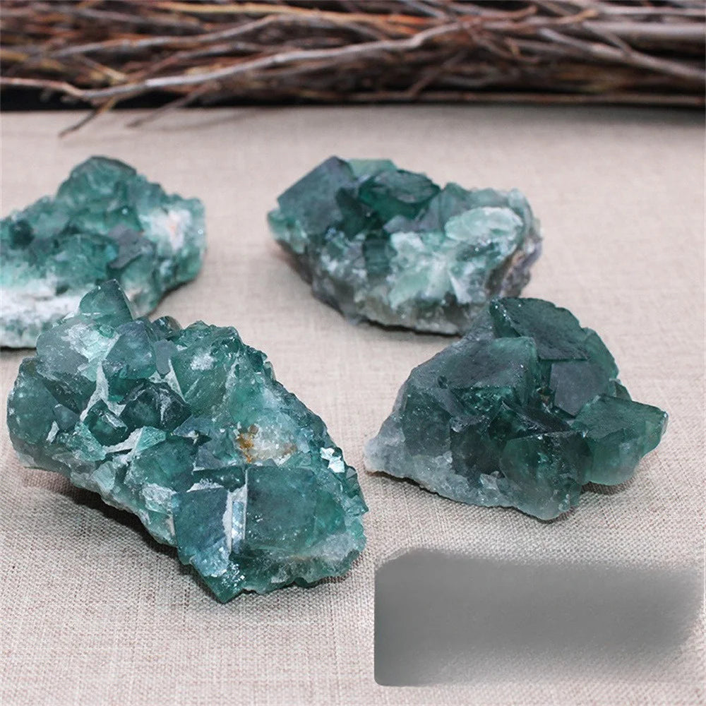Green crystal rocks on a textured surface with a natural background