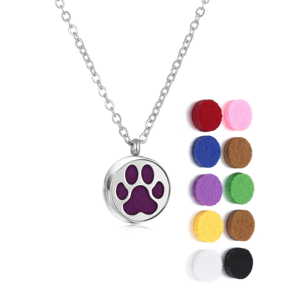 Necklace with a paw print pendant and colorful felt pads on a white background