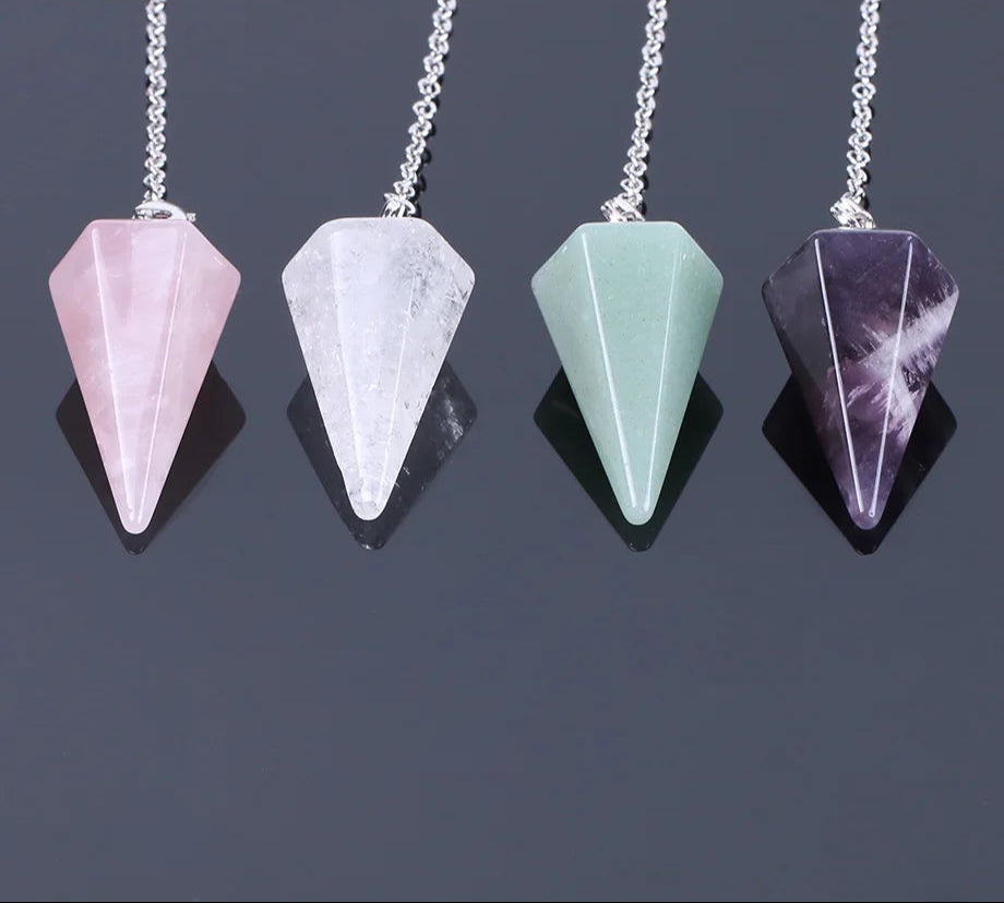 Four crystal pendant necklaces on a dark background with 'Cala' brand logo.