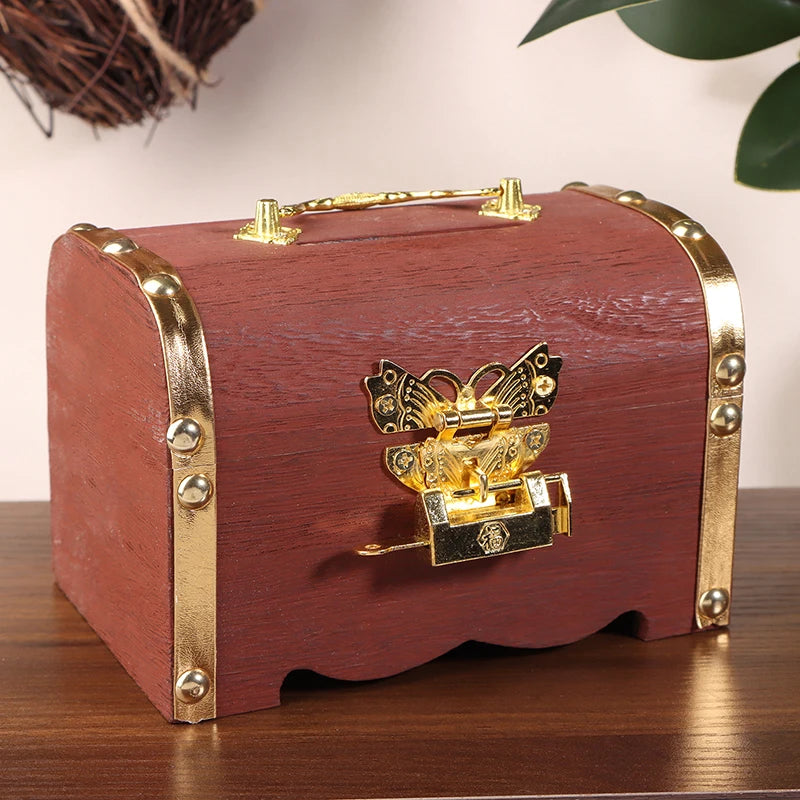 Wooden box with gold accents and a butterfly lock on a wooden surface.