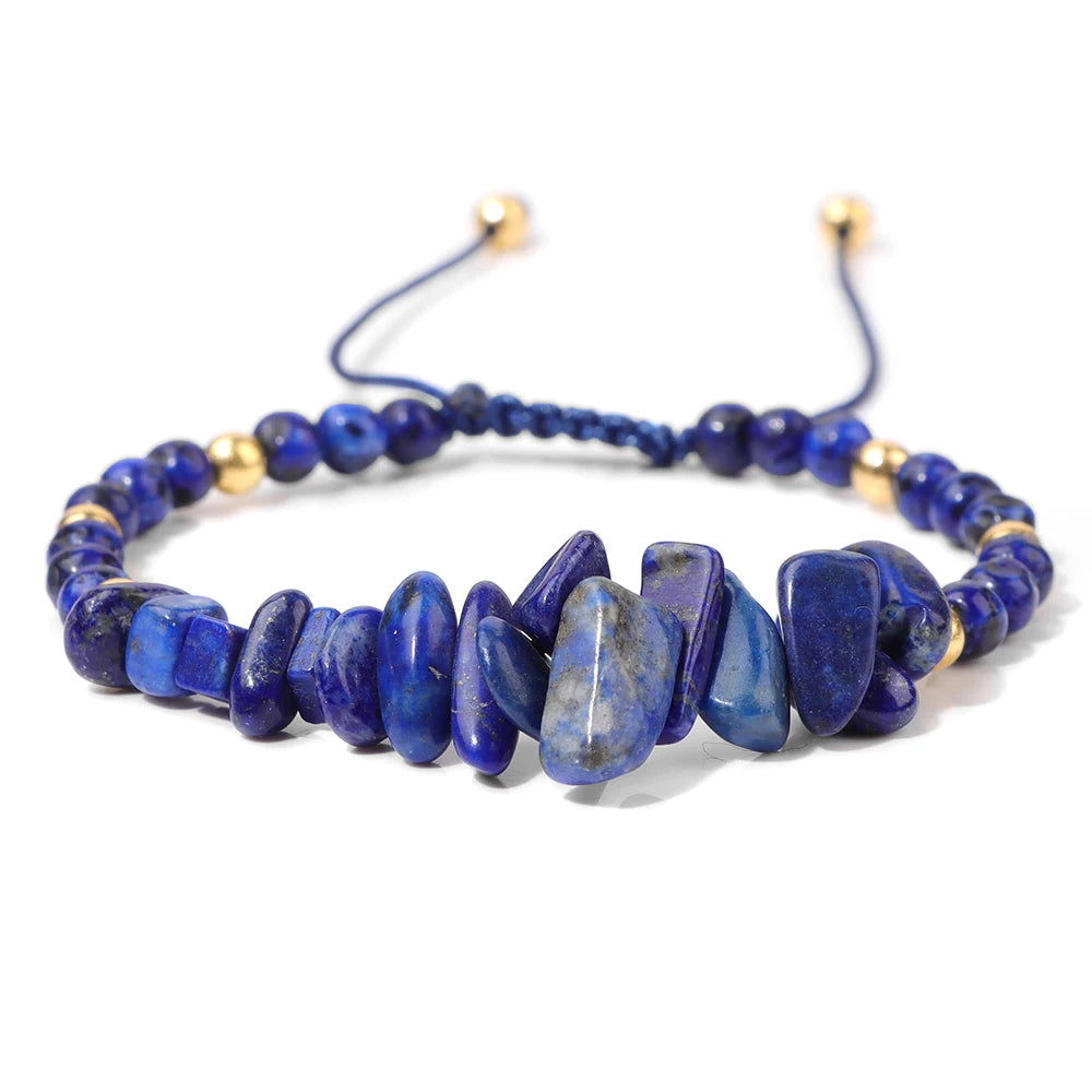 Blue stone beaded bracelet with gold accents on a white background