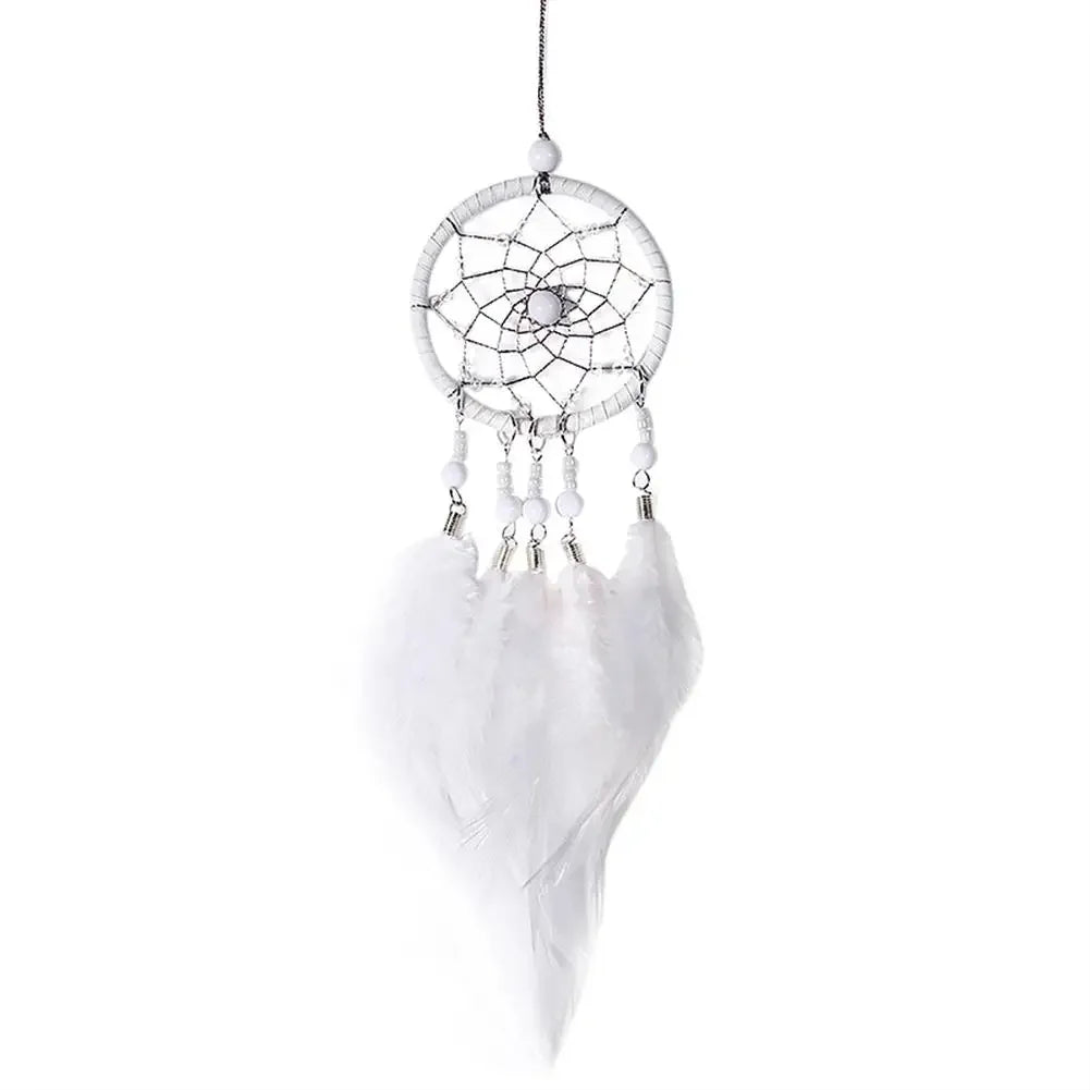 White dreamcatcher with feathers on a white background