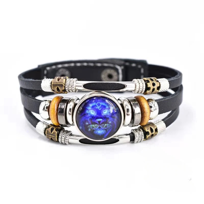 Multilayered bracelet with a blue stone and metallic accents on a white background