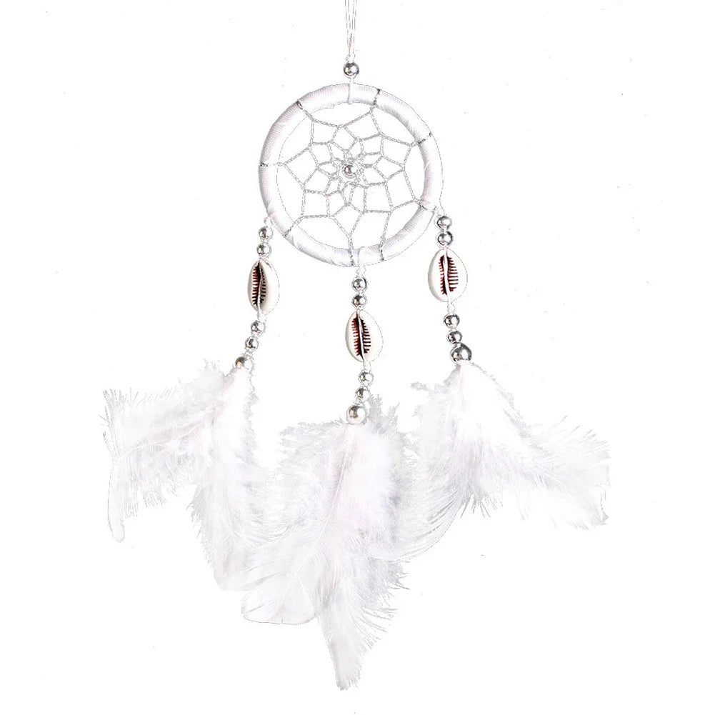 White dreamcatcher with feathers on a white background
