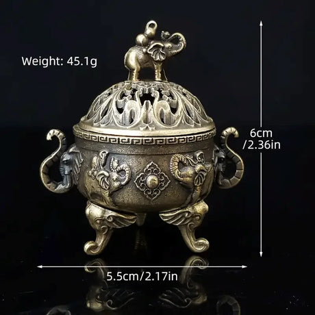 Decorative metal incense burner with elephant design, shown with measurements on a black background.