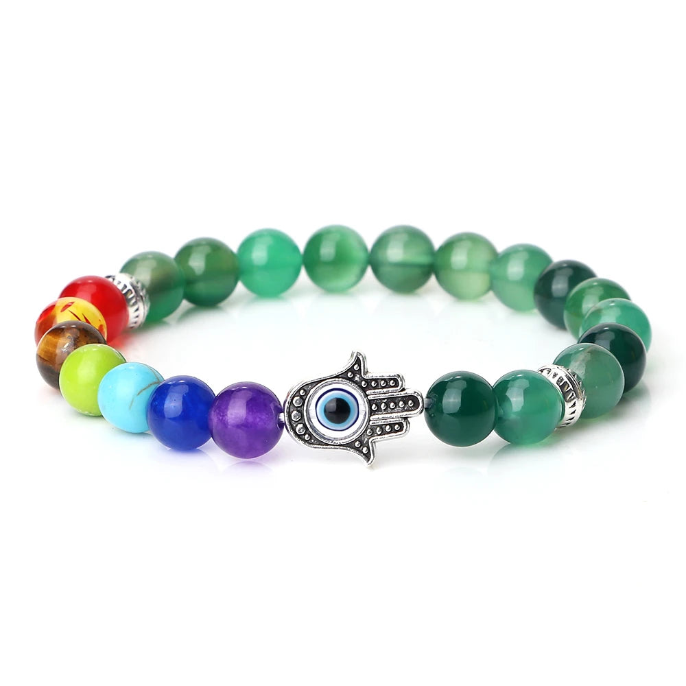 Colorful beaded bracelet with a Hamsa hand charm on a white background