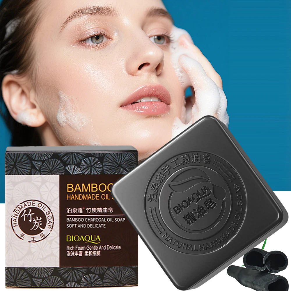 Black bamboo charcoal soap with packaging and a woman applying it to her face.