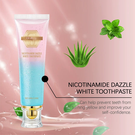 Oralime Nicotinamide Dazzle White Toothpaste tube with aloe vera leaves on a pink background