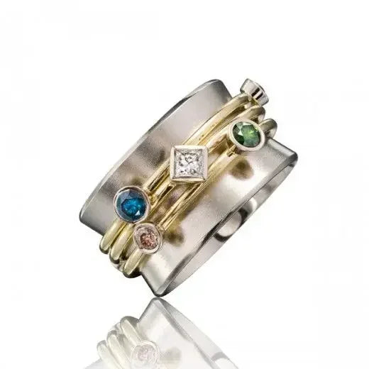 Multiband ring with various gemstones on a white background