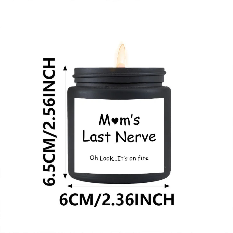 Black candle jar labeled 'Mom's Last Nerve' with dimensions on a white background