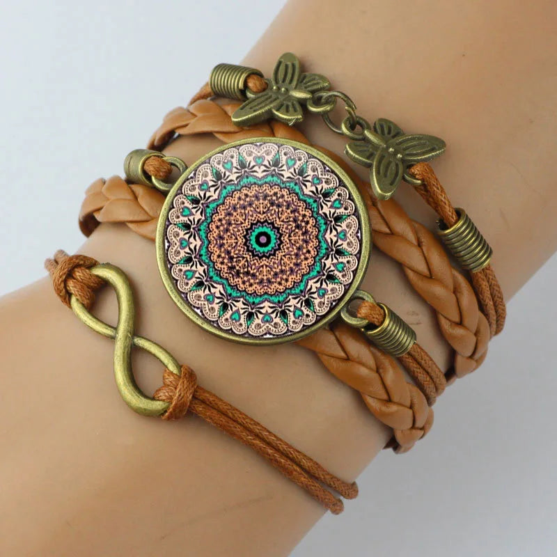 Bracelet with braided design and decorative elements on a wrist against a light background