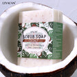 LIYALAN scrub soap bar in a coconut shell with a visible label.