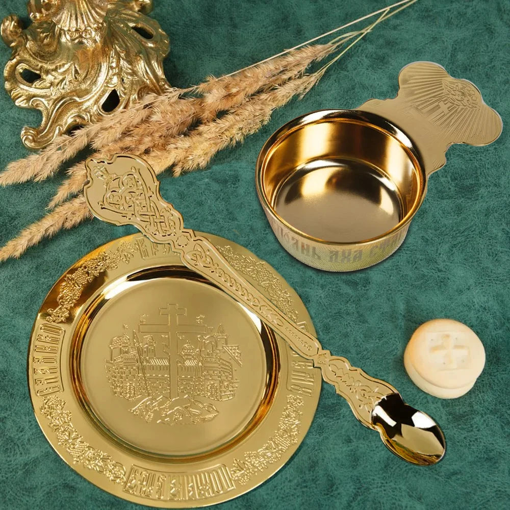 Decorative gold spoon and dish on a green background