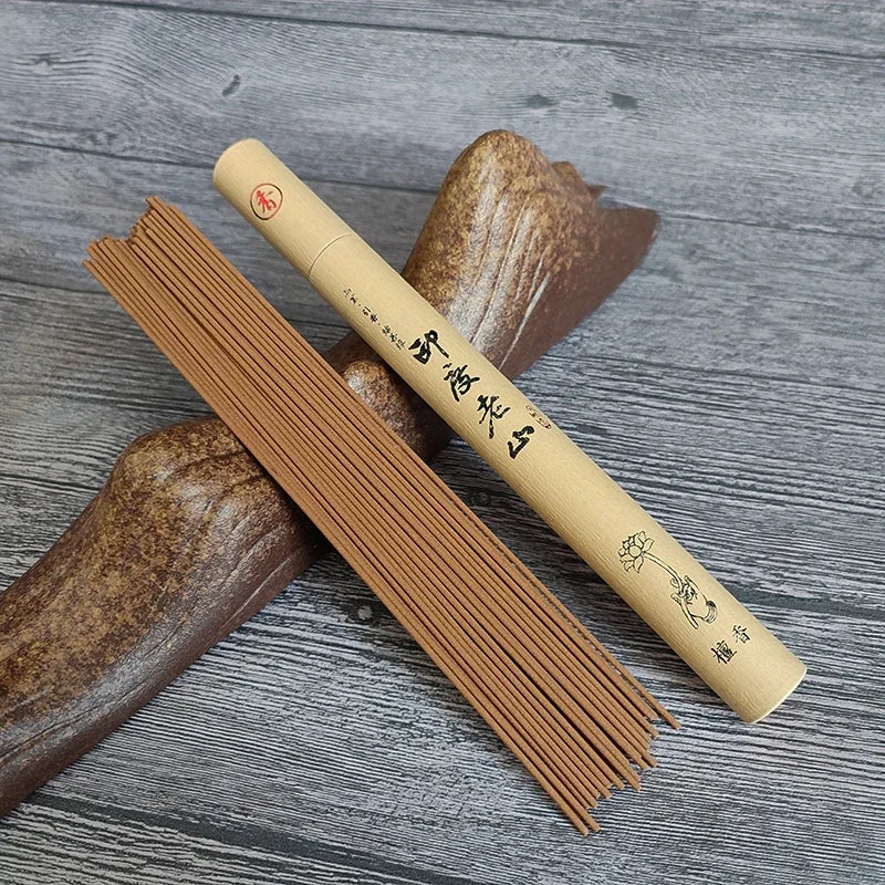 Incense sticks and their packaging on a wooden surface