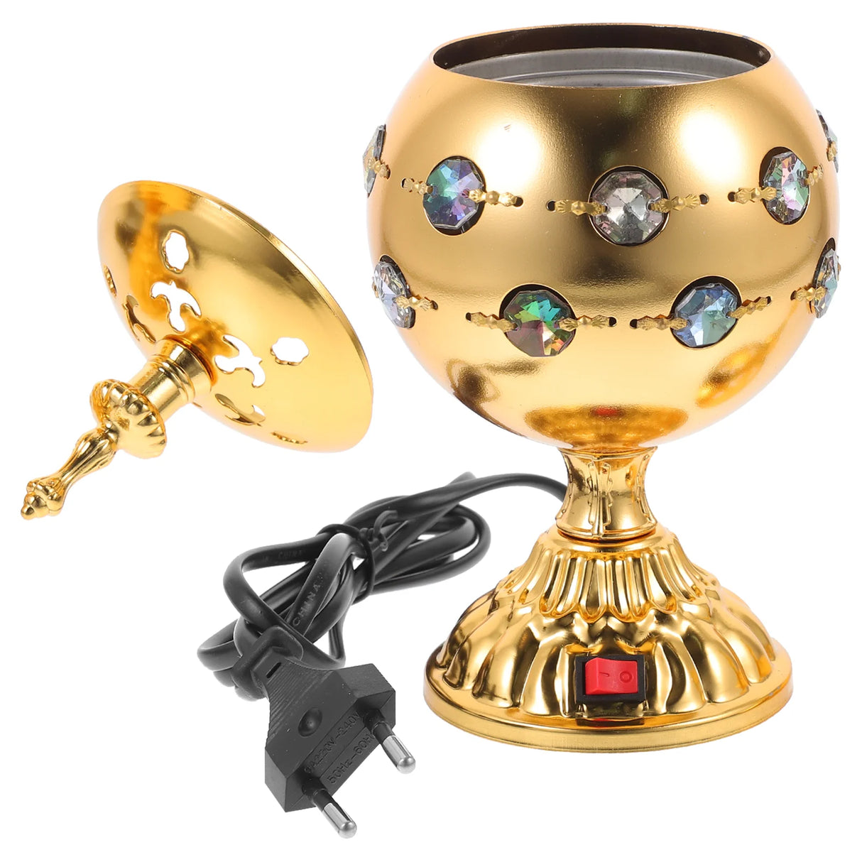 Decorative gold lamp with gemstones and a power plug on a white background