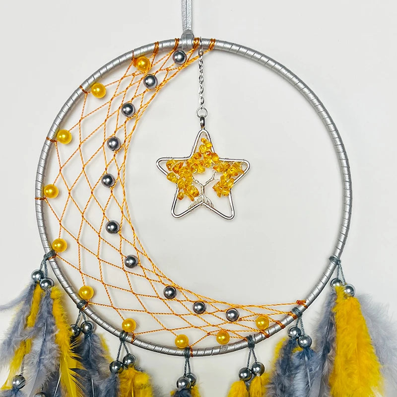 Dreamcatcher with yellow beads, feathers, and a star-shaped ornament on a white background