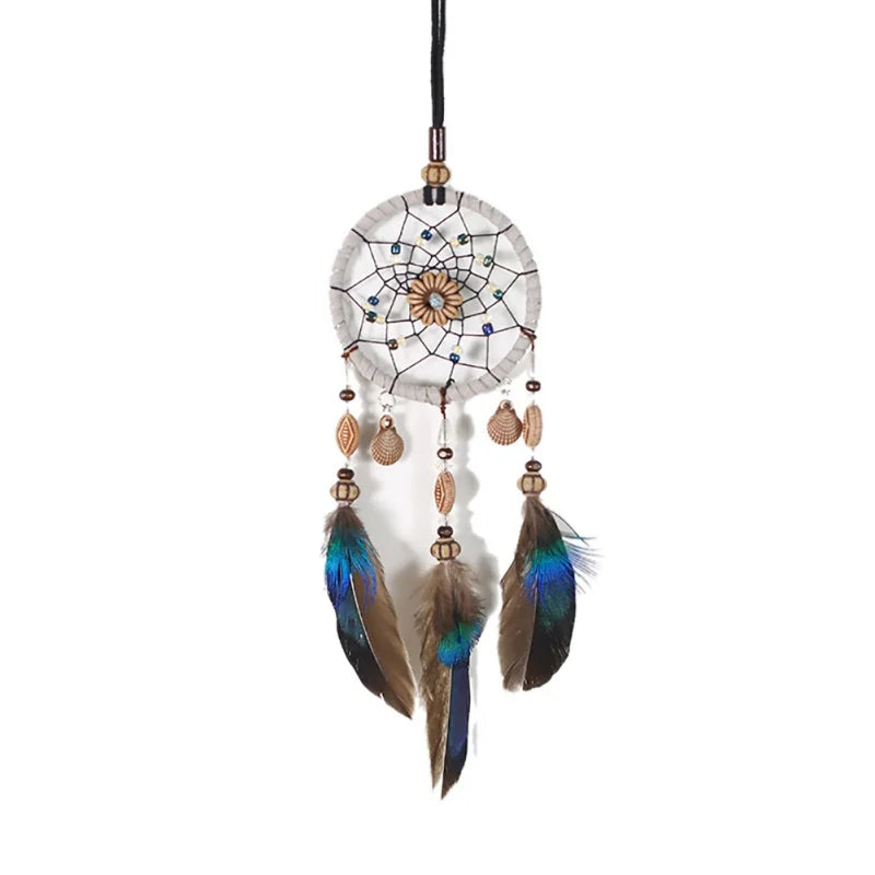 Dreamcatcher with feathers on a white background