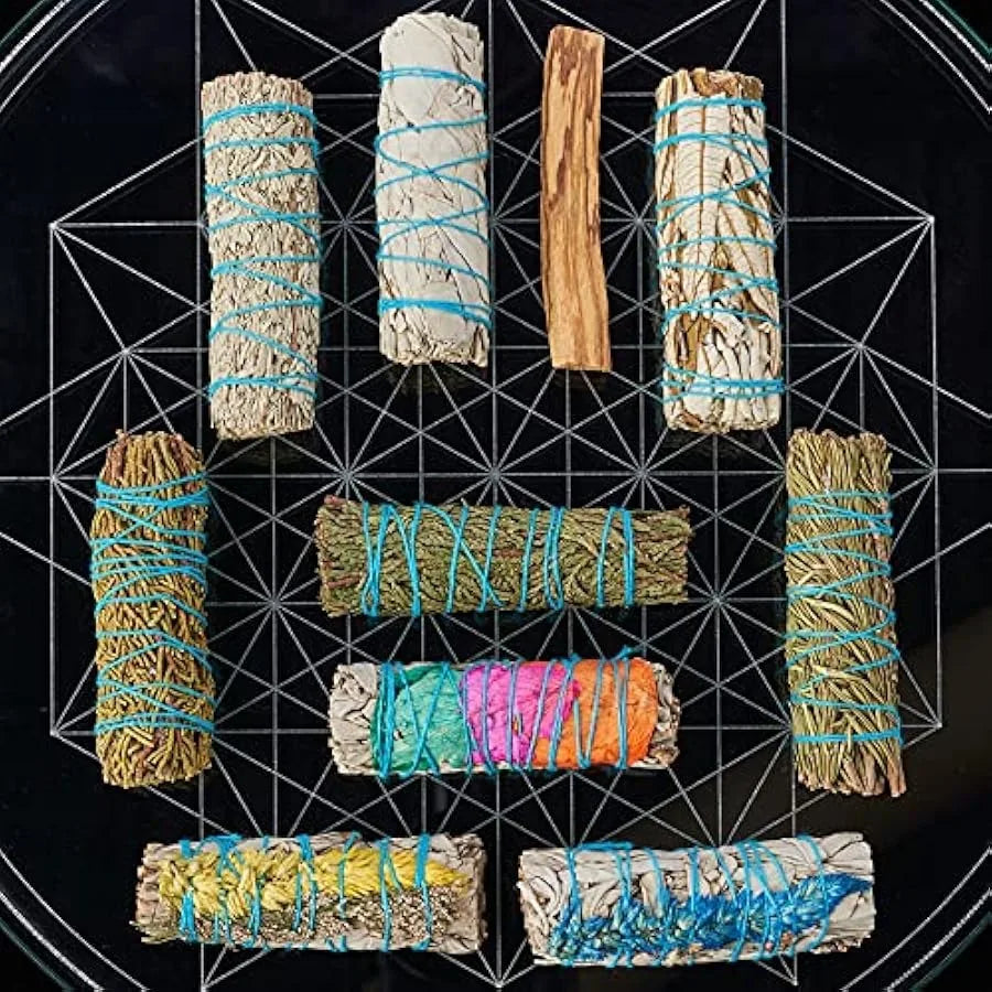 Collection of smudge sticks with colorful string on a black geometric background