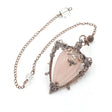 Necklace with a pink teardrop pendant and intricate metalwork on a white background