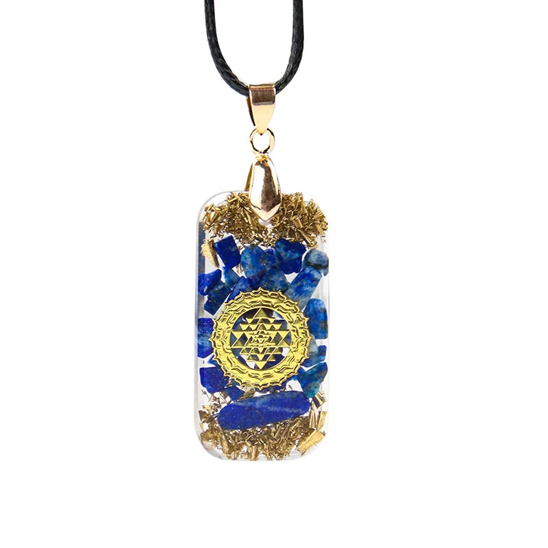 Necklace with a pendant featuring blue stones and gold accents on a white background