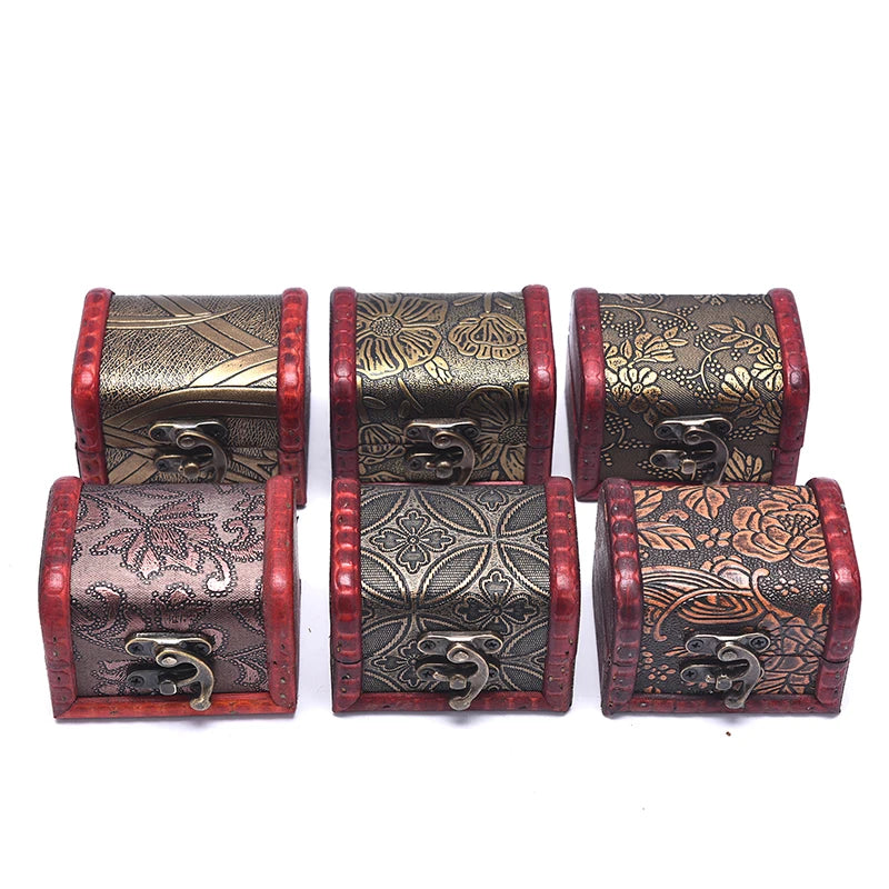 Set of four decorative wooden boxes with intricate patterns on a white background