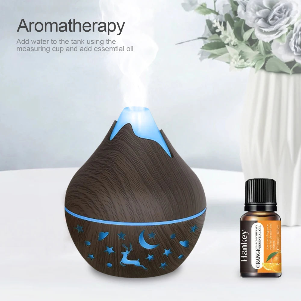 Aromatherapy diffuser with wooden design and essential oil bottle on a light background