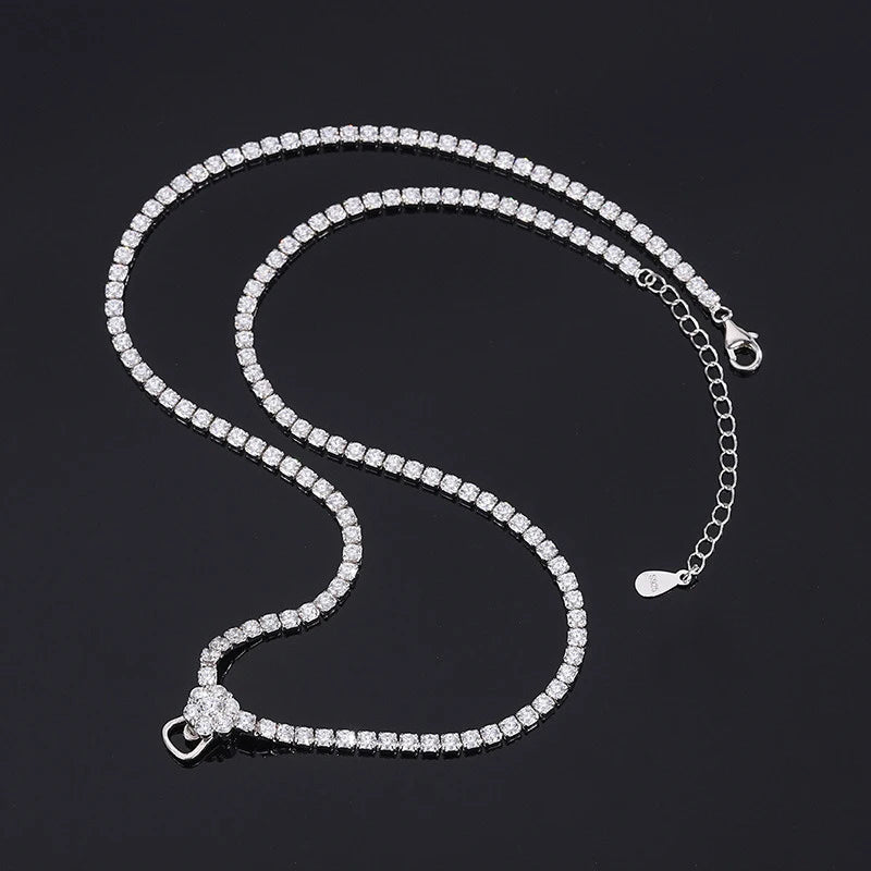 Silver bracelet with clear stones on a black background