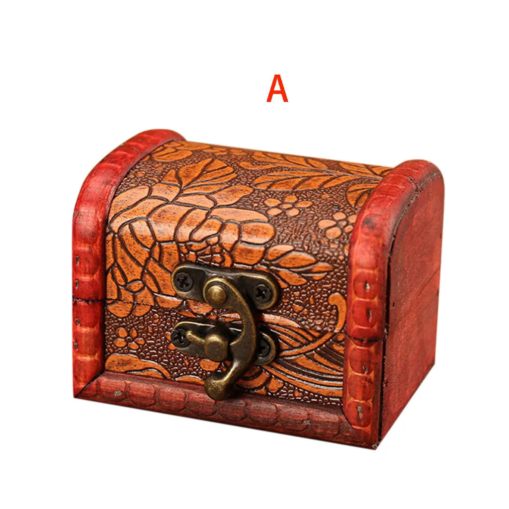 Wooden jewelry box with floral patterns and a lock on a white background
