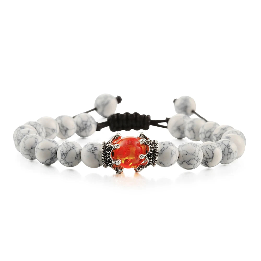 Bracelet with white beads and a colorful clasp on a white background
