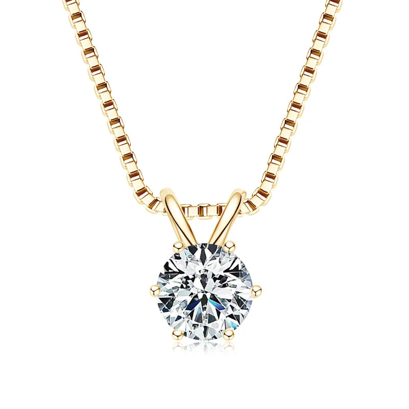 Gold necklace with a round diamond pendant on a white background