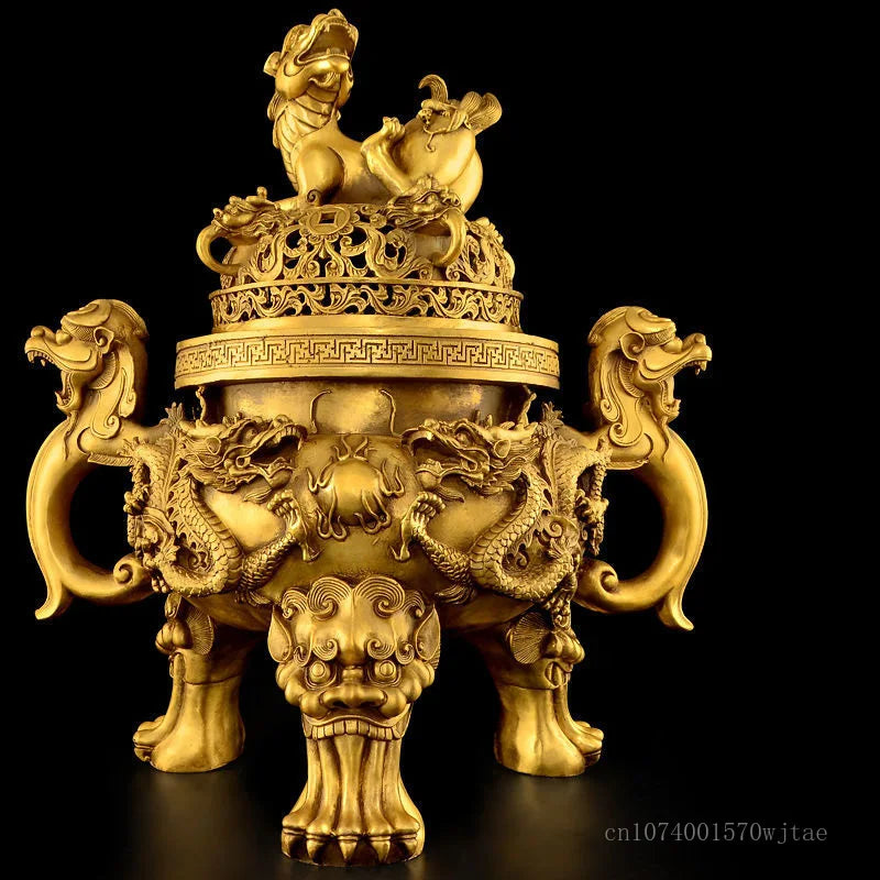 Gold-colored traditional Chinese incense burner with intricate designs on a black background