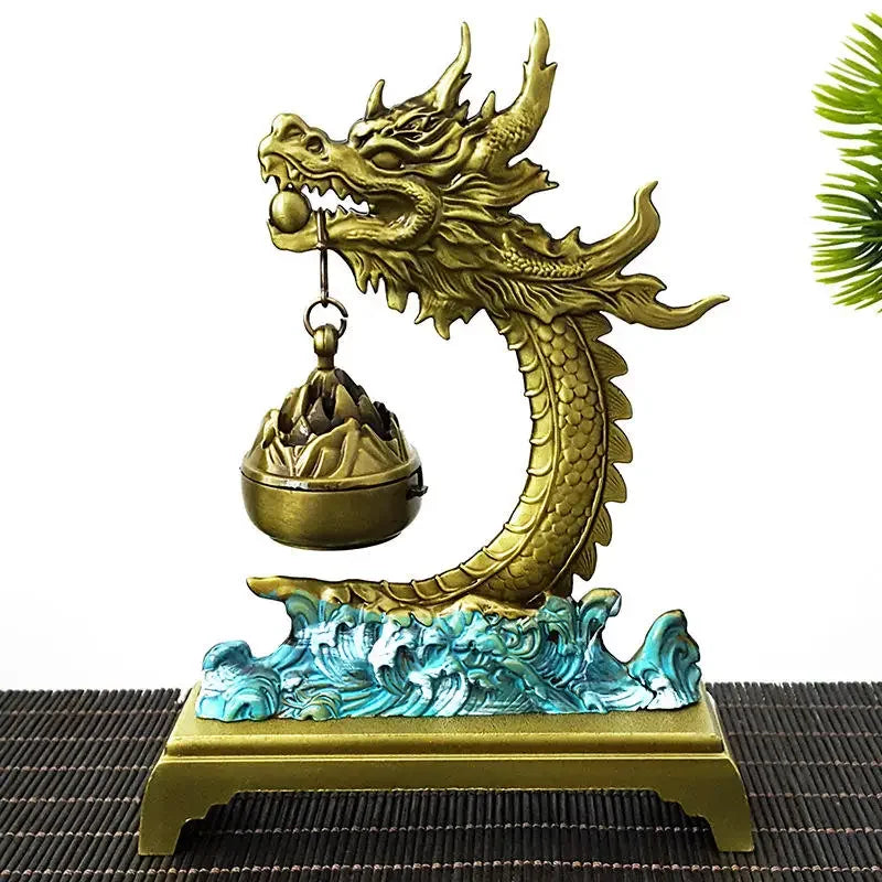 Gold dragon statue with wave base on a white background