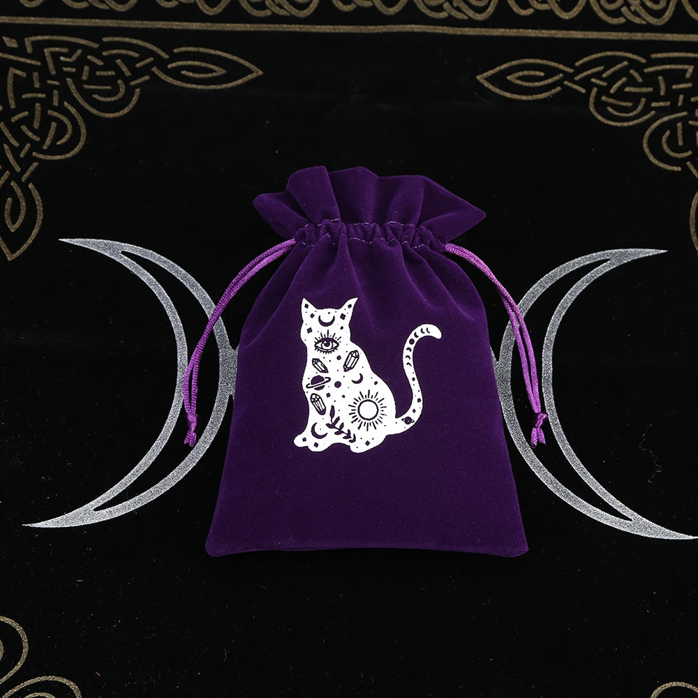 Purple drawstring bag with a white cat design on a black background with moon symbols.