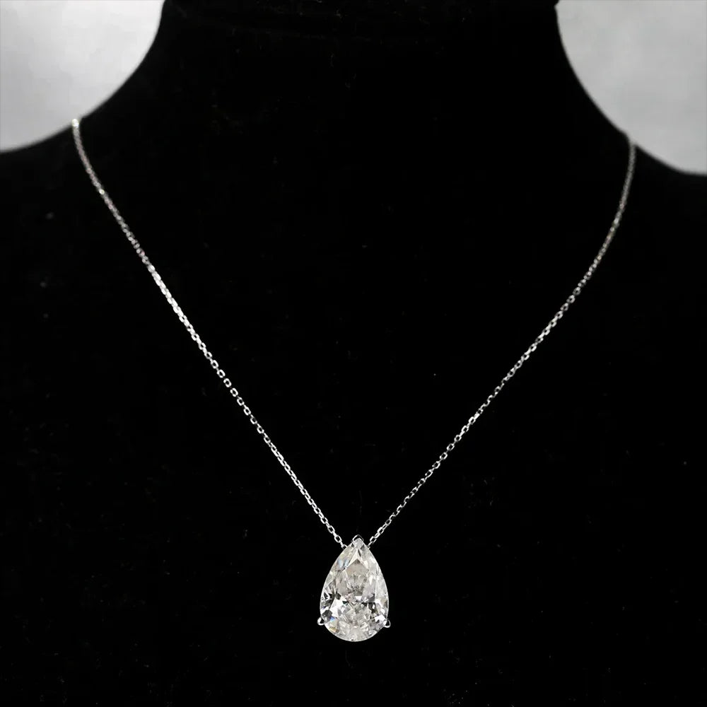 Teardrop diamond pendant on a black background