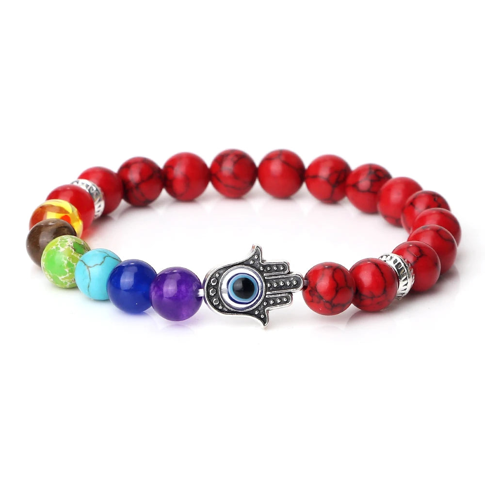 Multicolored beaded bracelet with a Hamsa hand charm on a white background