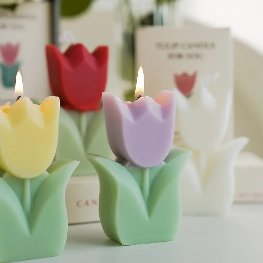 Tulip-shaped candles in various colors with a blurred background